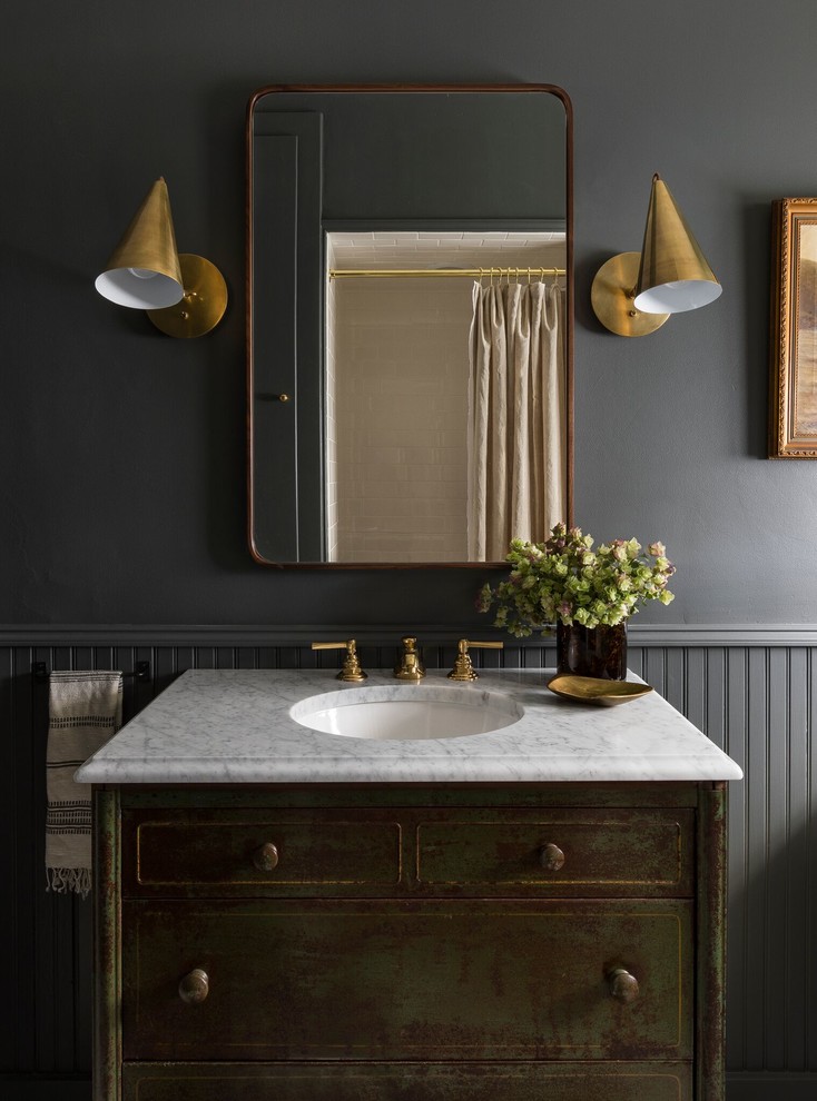 This is an example of a traditional bathroom in Seattle with distressed cabinets, grey walls, an undermount sink, white benchtops and flat-panel cabinets.