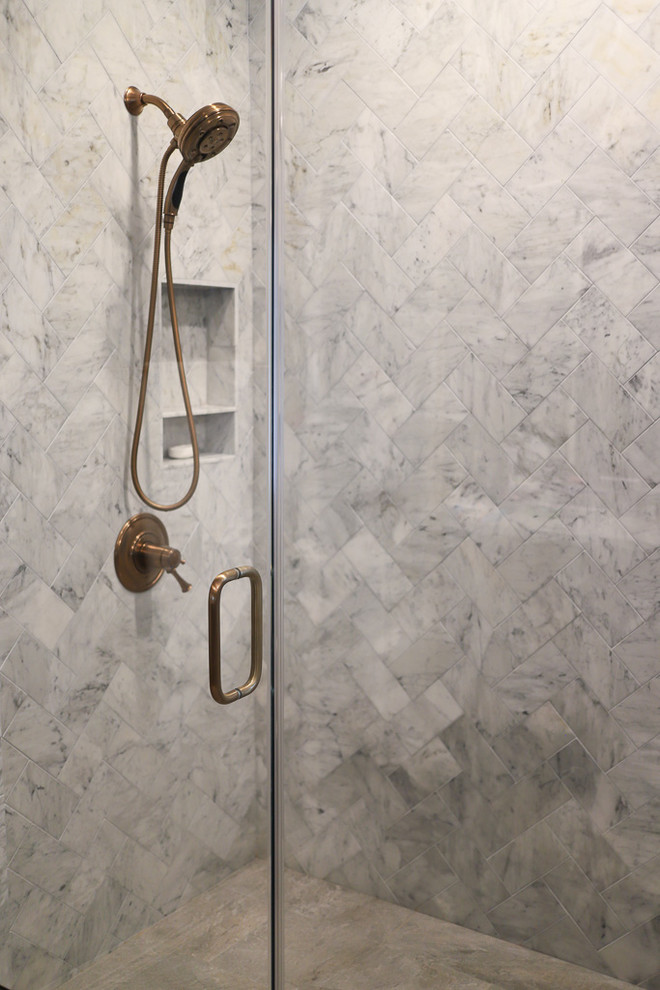 Example of a large transitional master white tile and marble tile porcelain tile and gray floor corner shower design with shaker cabinets, dark wood cabinets, an undermount tub, a one-piece toilet, brown walls, an undermount sink, quartz countertops, a hinged shower door and white countertops