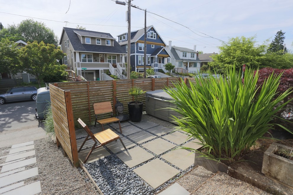 Inspiration for a small contemporary front yard patio in Portland with concrete pavers and a pergola.