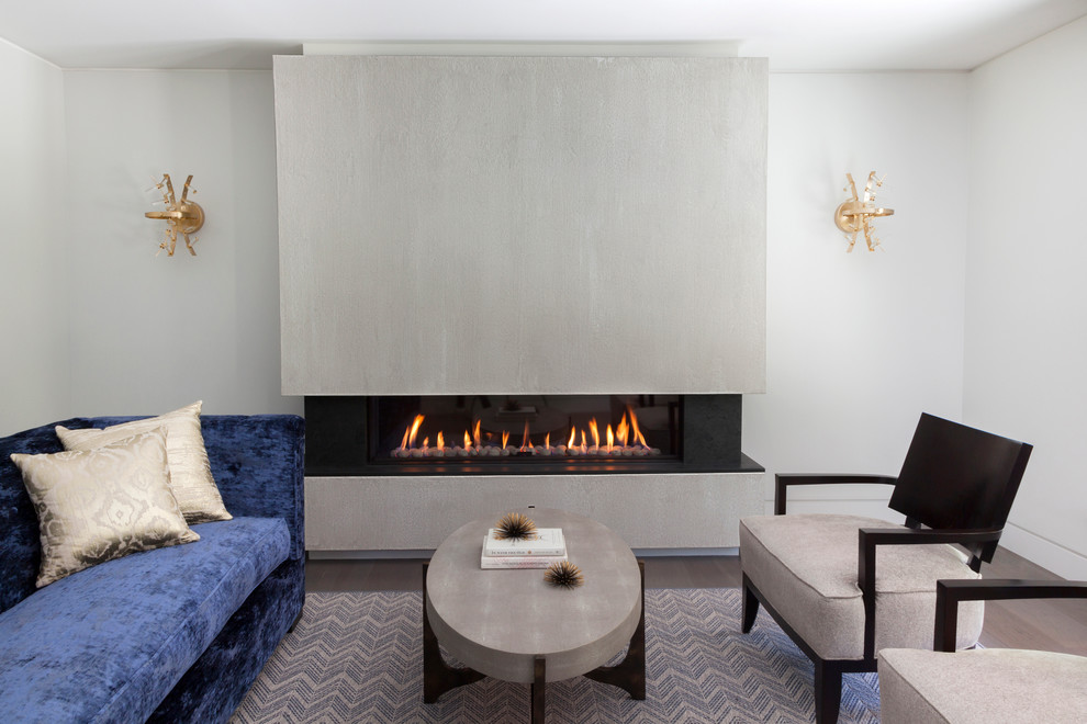 This is an example of a mid-sized contemporary formal enclosed living room in New York with white walls, painted wood floors, a ribbon fireplace, a concrete fireplace surround and no tv.