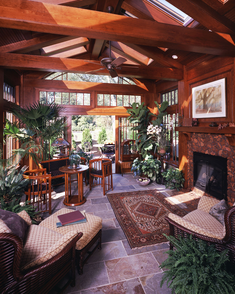 Design ideas for a traditional sunroom in Minneapolis with a standard fireplace.