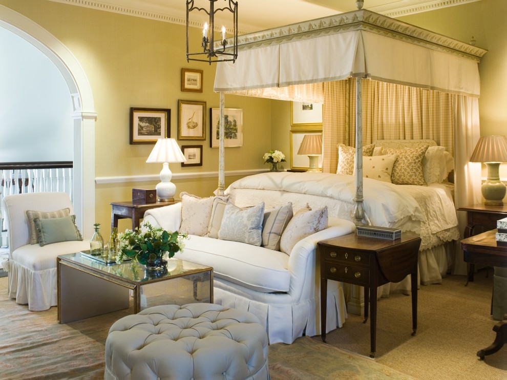 Inspiration for a large traditional master bedroom in Atlanta with green walls and dark hardwood floors.