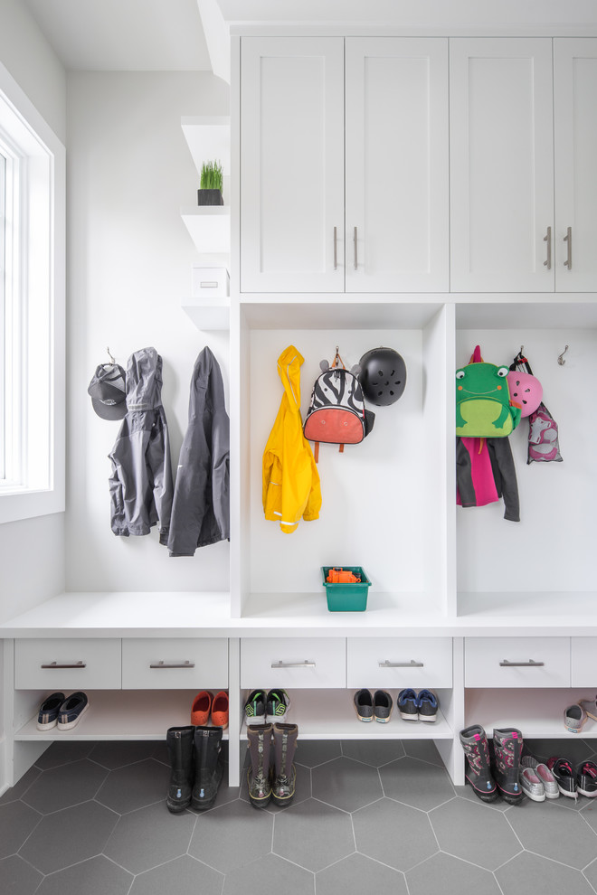 Small transitional mudroom in Vancouver with grey walls, porcelain floors and grey floor.