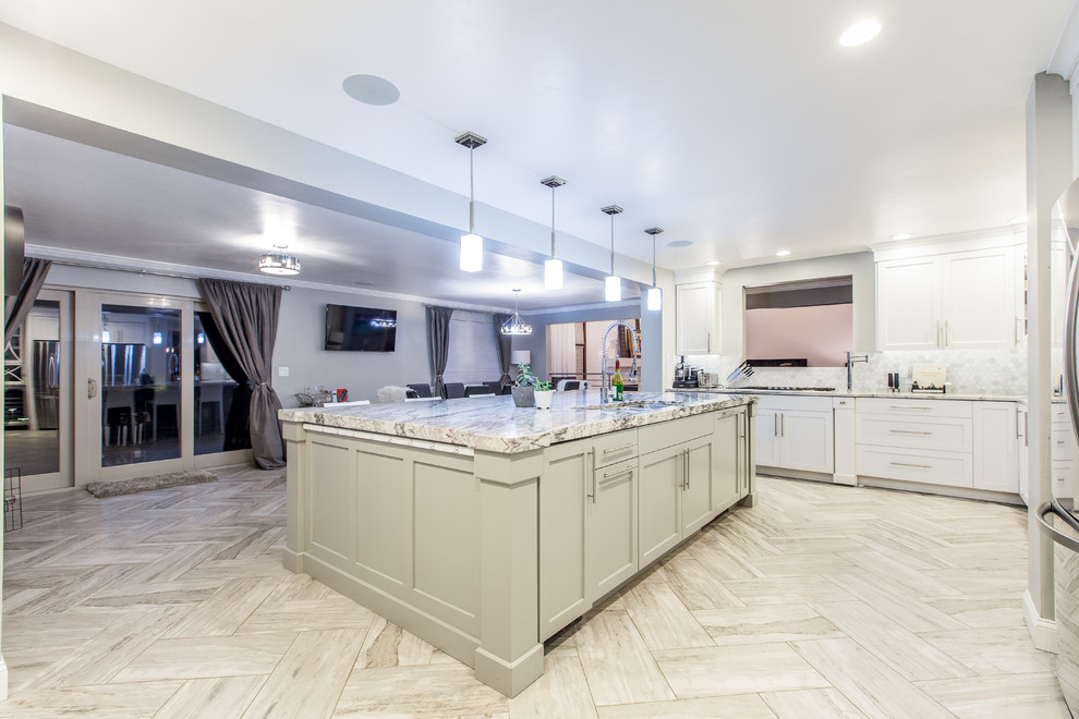 Inspiration for an expansive contemporary u-shaped kitchen in Denver with an undermount sink, shaker cabinets, grey cabinets, granite benchtops and with island.