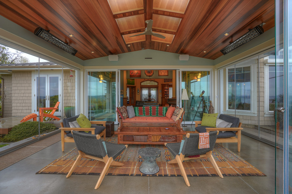 Eclectic brown floor sunroom photo in Seattle with a skylight