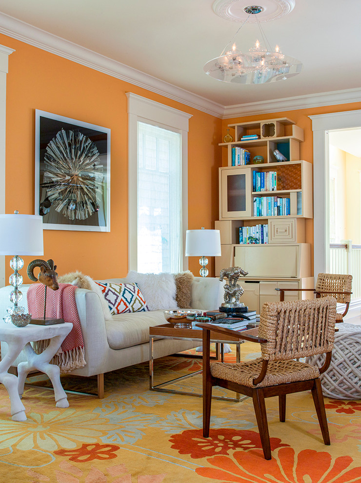 Inspiration for a mid-sized transitional family room in San Francisco with orange walls, no fireplace, no tv and carpet.