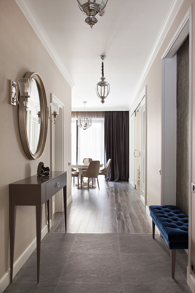 Transitional hallway in Moscow with beige walls and grey floor.