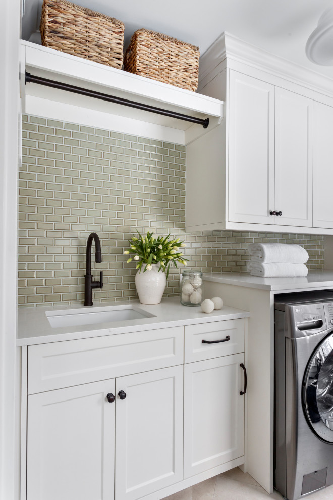 Utility room - mid-sized transitional porcelain tile and beige floor utility room idea in Other with an undermount sink, green cabinets, quartz countertops, green backsplash, subway tile backsplash, beige walls, a side-by-side washer/dryer and white countertops