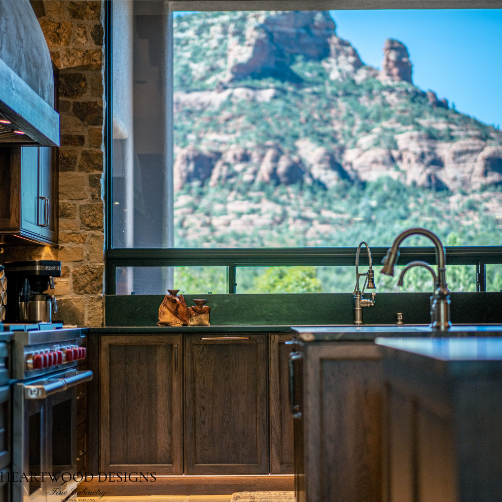 Inspiration for a transitional kitchen remodel with shaker cabinets, dark wood cabinets, paneled appliances and an island