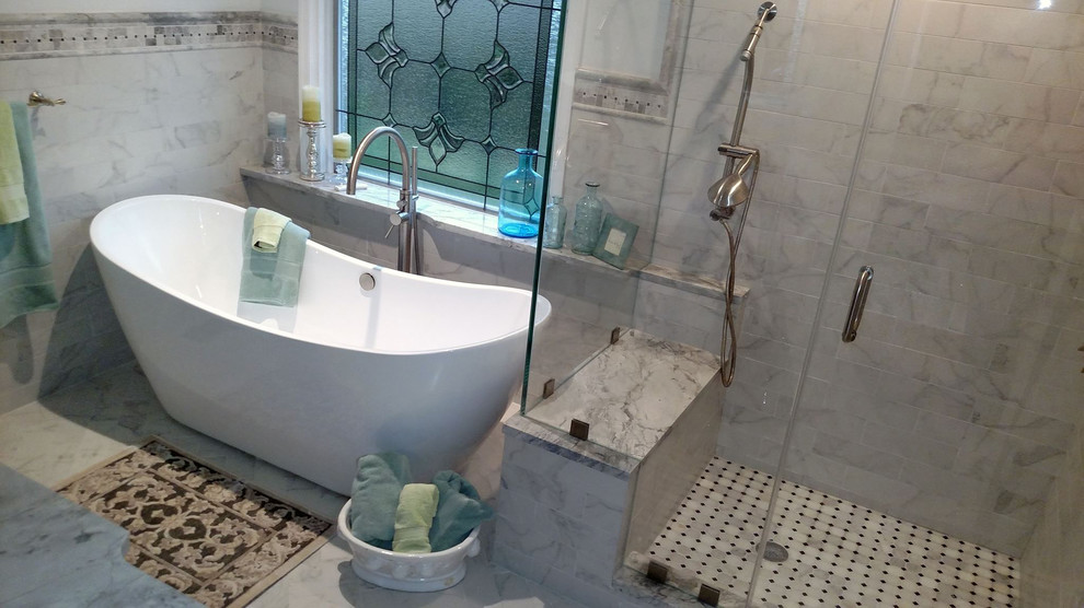 Example of a mid-sized transitional master black and white tile and porcelain tile porcelain tile freestanding bathtub design with gray cabinets, a two-piece toilet, white walls, an undermount sink and granite countertops