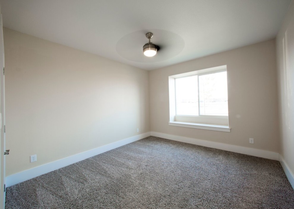 Example of a transitional guest carpeted home design design in Austin with beige walls