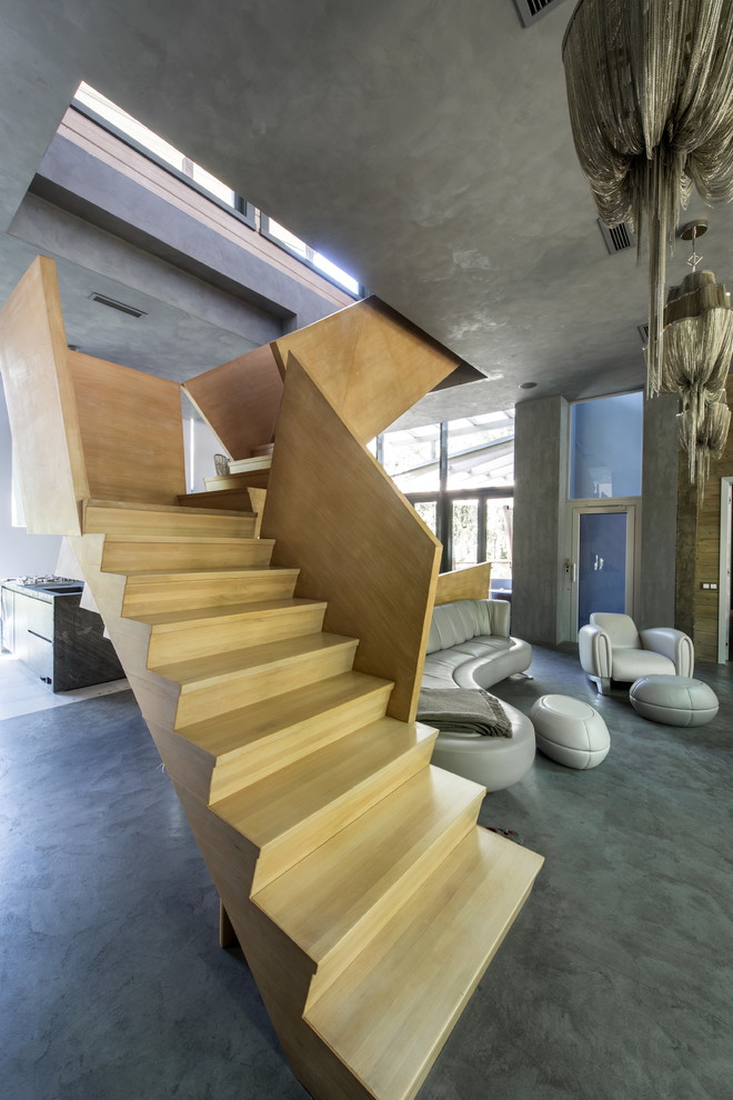 This is an example of a large contemporary wood l-shaped staircase in Moscow with wood risers.