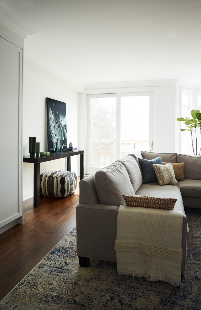 Mid-sized transitional open concept dark wood floor home design photo in Toronto with white walls, a stone fireplace and a media wall