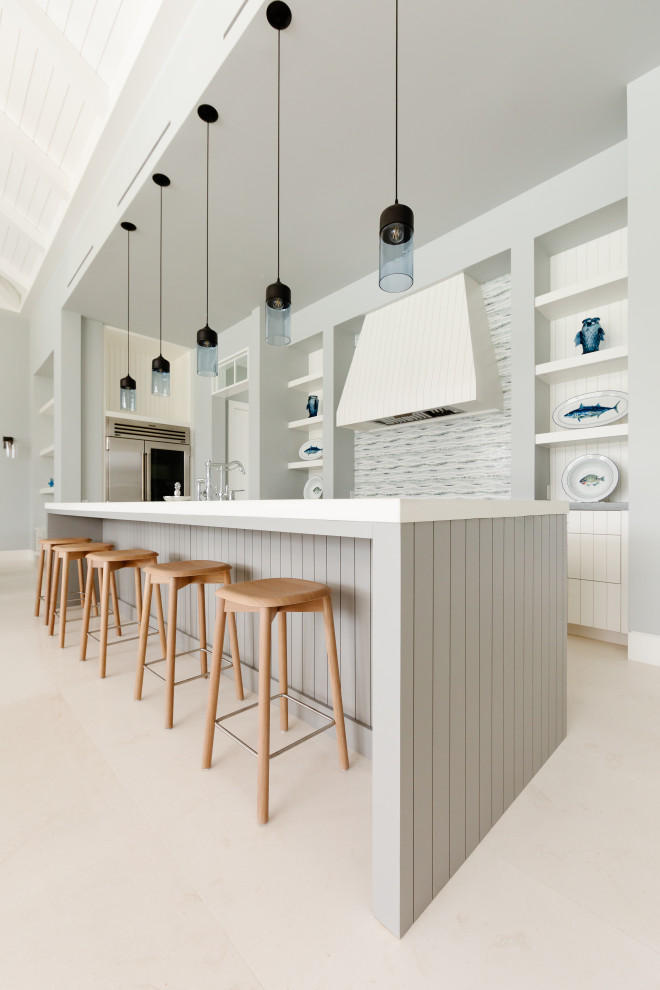 Example of a transitional kitchen design in Tampa with an island