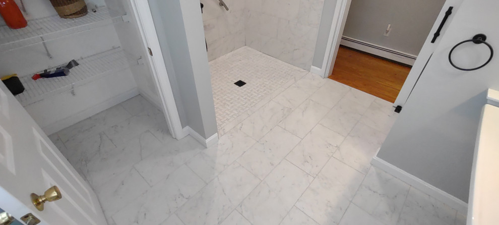 Replaced wood floor with a tile floor with zero treshold shower