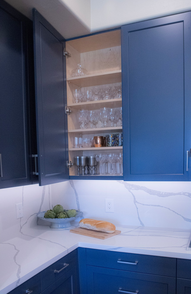 Mid-sized transitional eat-in kitchen photo in Phoenix with an undermount sink, shaker cabinets, blue cabinets, quartz countertops, white backsplash, quartz backsplash, stainless steel appliances, an island and white countertops