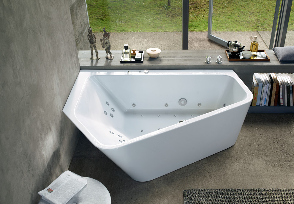 This is an example of an expansive contemporary bathroom with a corner tub.