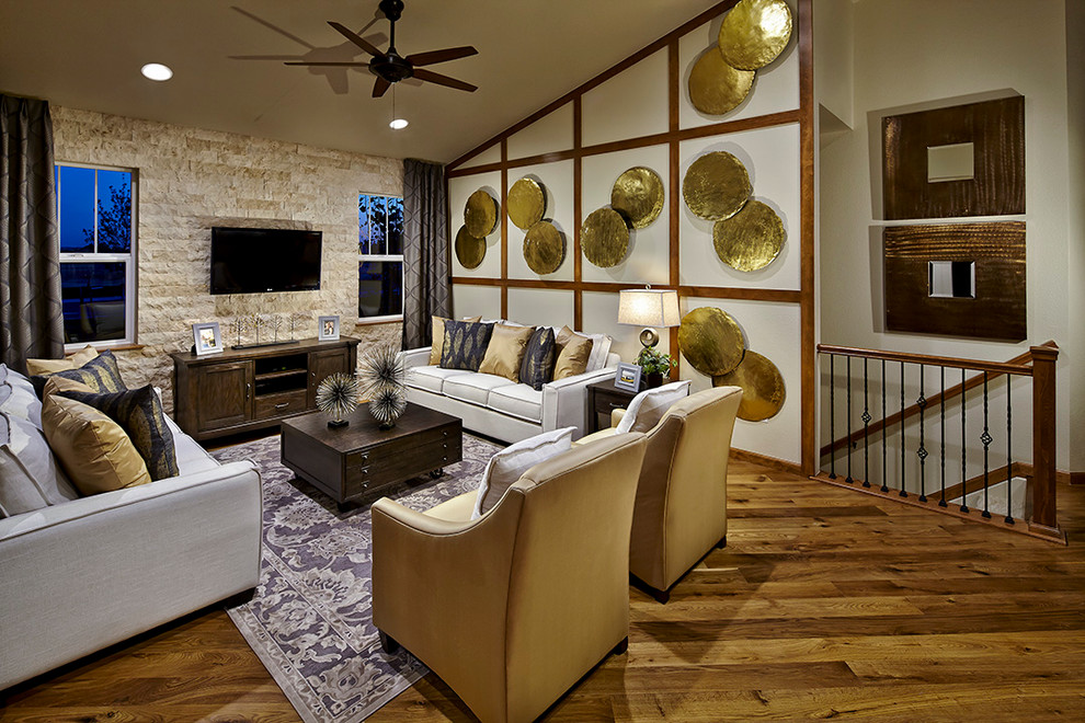 Design ideas for a transitional living room in Denver with medium hardwood floors and a wall-mounted tv.