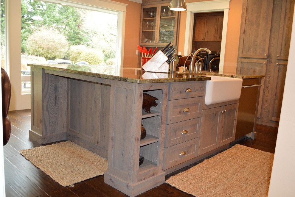 This is an example of a mid-sized arts and crafts l-shaped eat-in kitchen in Portland with shaker cabinets, light wood cabinets and with island.