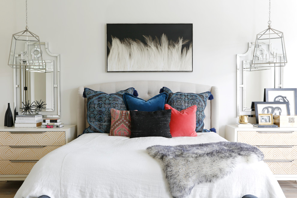 Inspiration for a mid-sized transitional master light wood floor and beige floor bedroom remodel in Nashville with white walls and no fireplace