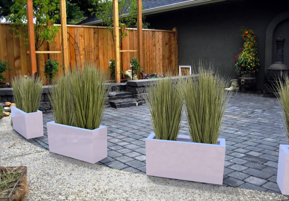 Inspiration for a large contemporary backyard patio in Toronto with a container garden and brick pavers.