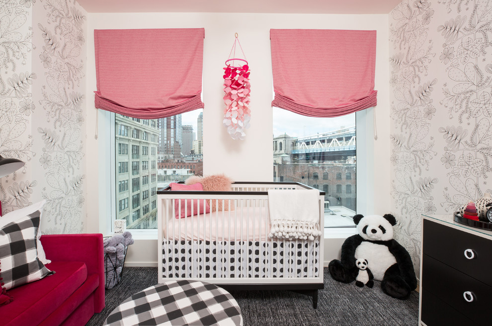 Contemporary nursery in New York with carpet for girls.