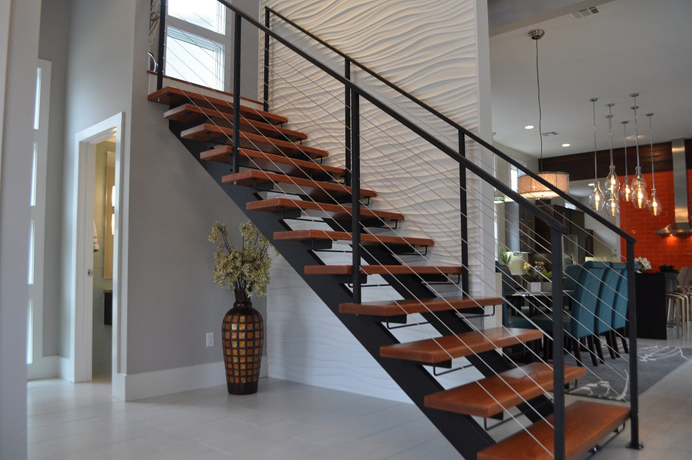 This is an example of a large contemporary wood straight staircase in New York with open risers.