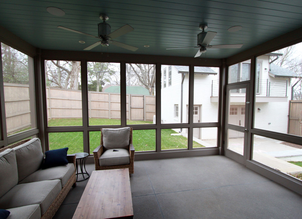 Photo of a mid-sized traditional backyard screened-in verandah in Nashville with concrete slab and a roof extension.