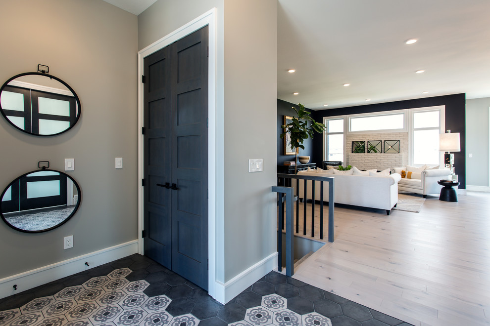 Inspiration for a mid-sized transitional porcelain tile and beige floor foyer remodel
