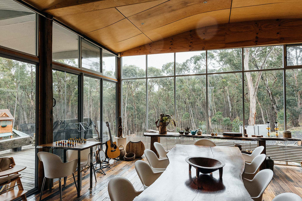 This is an example of a mid-sized dining room in Melbourne with light hardwood floors.