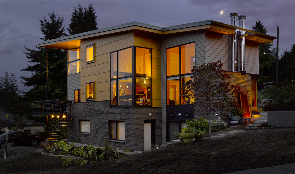 This is an example of a modern exterior in Seattle with stone veneer.
