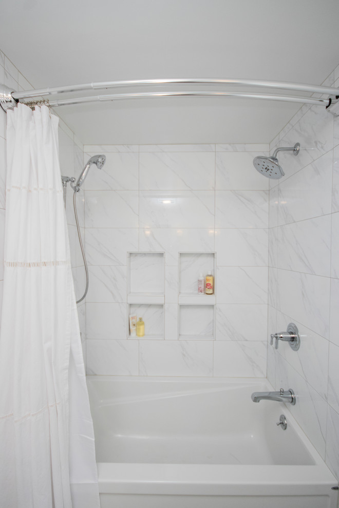 Mid-sized modern master bathroom in Providence with beaded inset cabinets, blue cabinets, a drop-in tub, an open shower, a one-piece toilet, white tile, ceramic tile, blue walls, ceramic floors, an undermount sink, tile benchtops, white floor and a shower curtain.