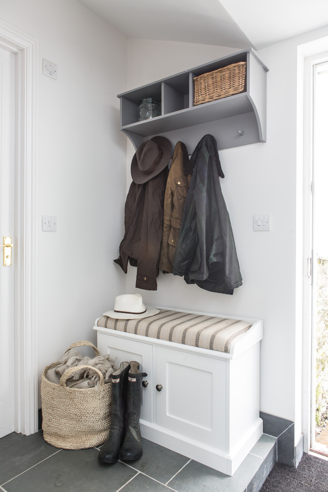 Small nautical boot room in Cornwall with white walls.