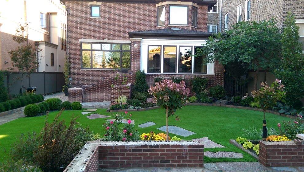 Suburban Backyard Artificial Turf Hardscape Flagstone Foliage