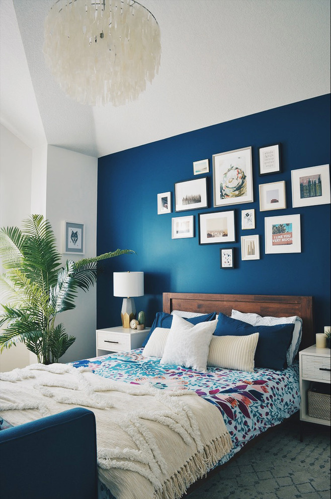 Design ideas for an eclectic bedroom in Calgary with blue walls.