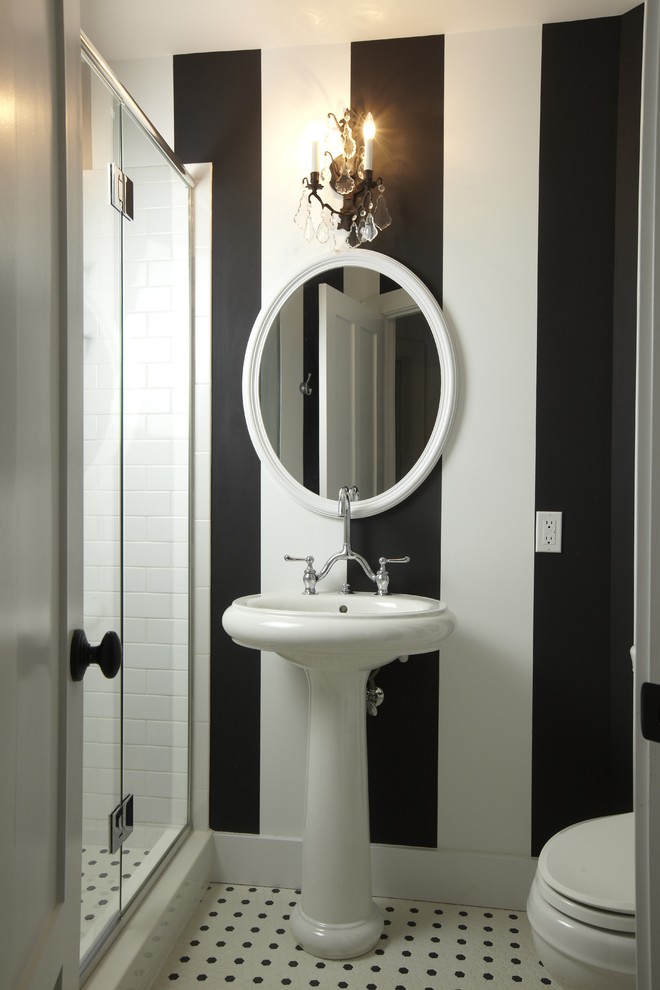 Design ideas for a traditional bathroom in Tampa with a pedestal sink, subway tile and black and white tile.
