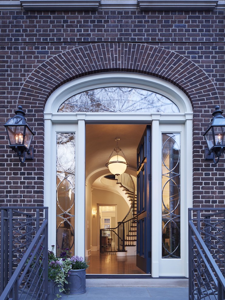 Design ideas for a large traditional three-storey brick brown exterior in Chicago.