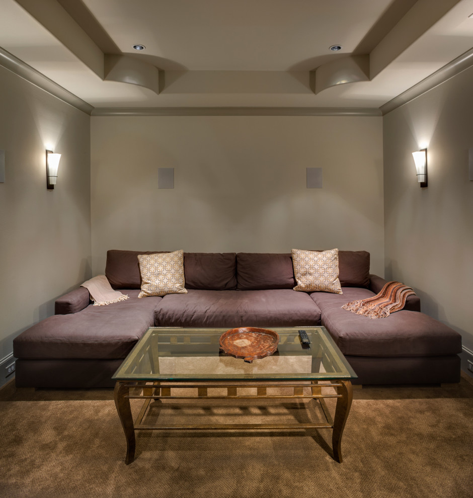 This is an example of a mid-sized transitional enclosed home theatre in Houston with grey walls, carpet and beige floor.