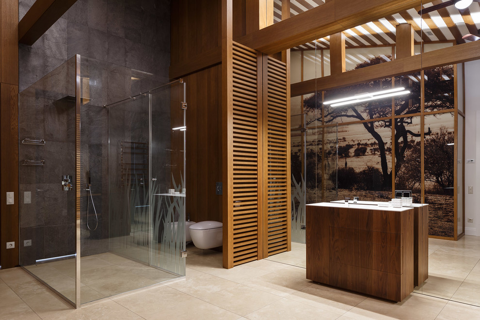 Inspiration for a contemporary 3/4 bathroom in Saint Petersburg with flat-panel cabinets, dark wood cabinets, a curbless shower, gray tile, brown walls, beige floor, a hinged shower door and a wall-mount toilet.