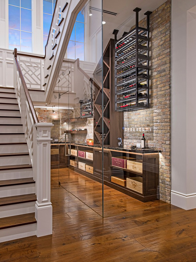 Wine cellar - transitional medium tone wood floor and brown floor wine cellar idea in Miami with display racks