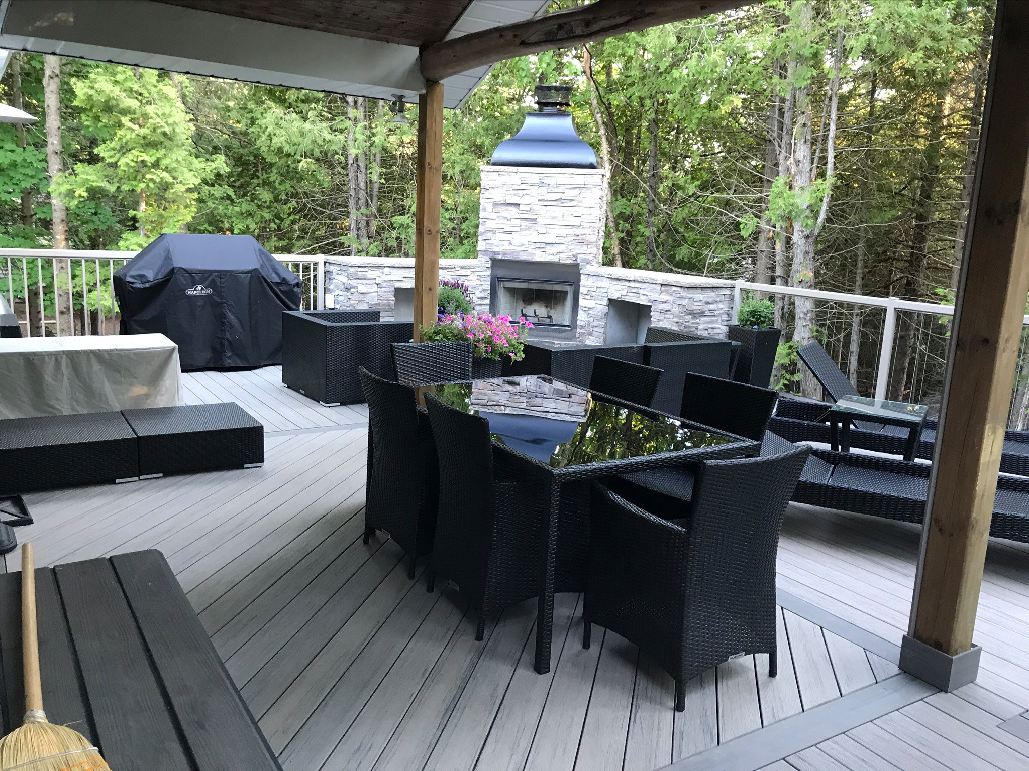 This composite deck provides a maintenance free outdoor living space complete with a fireplace and dining area. This deck doubles as a front entrance, that is if you don't get caught up enjoying the w