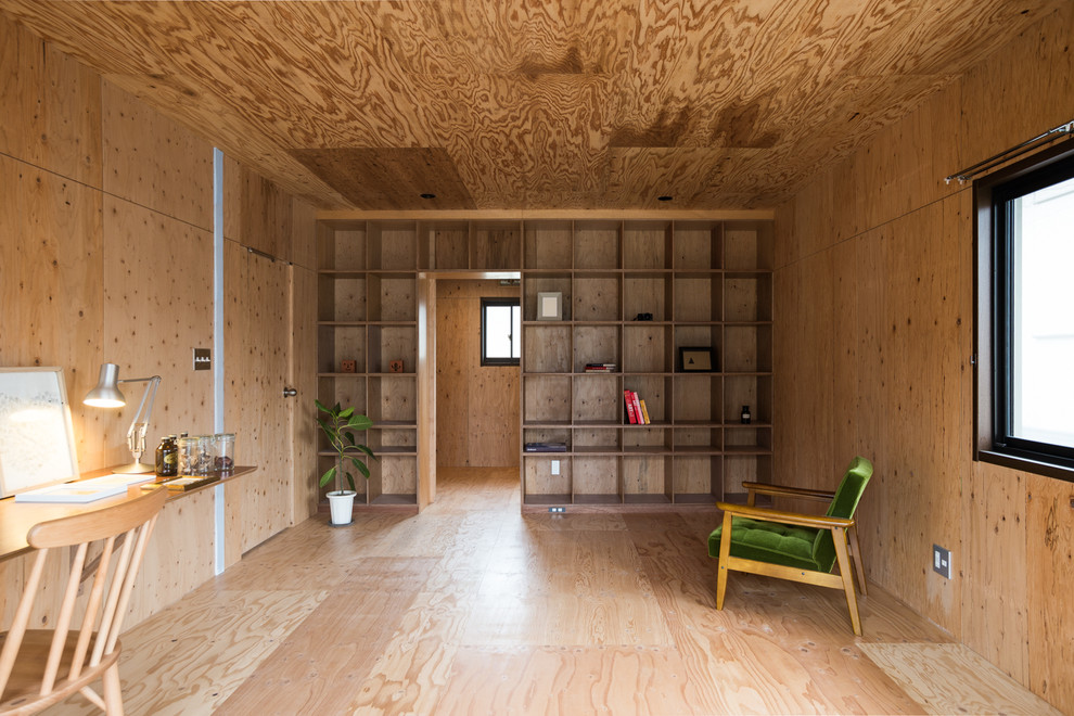 Design ideas for an industrial living room in Fukuoka with brown walls, medium hardwood floors and brown floor.