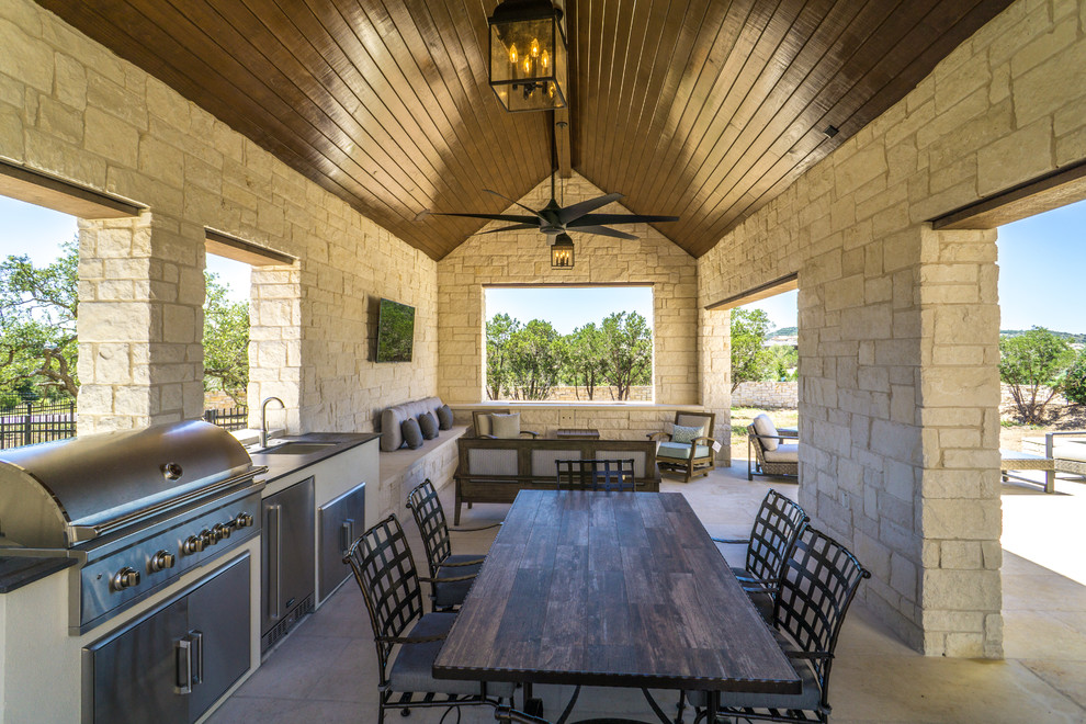 Inspiration for a large country backyard patio in Austin with concrete pavers and a gazebo/cabana.