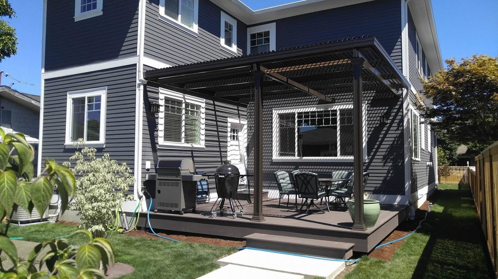Small transitional backyard patio photo in Phoenix with decking and a roof extension