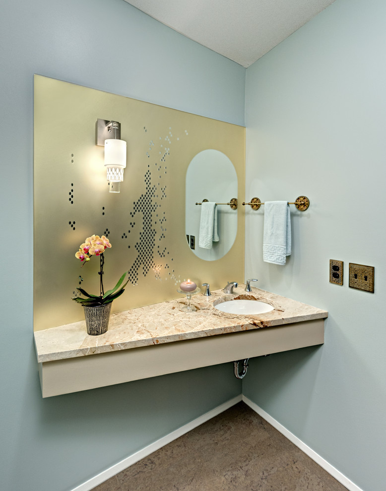 Photo of a mid-sized contemporary powder room in Minneapolis with grey walls, cork floors, an undermount sink, marble benchtops and grey floor.