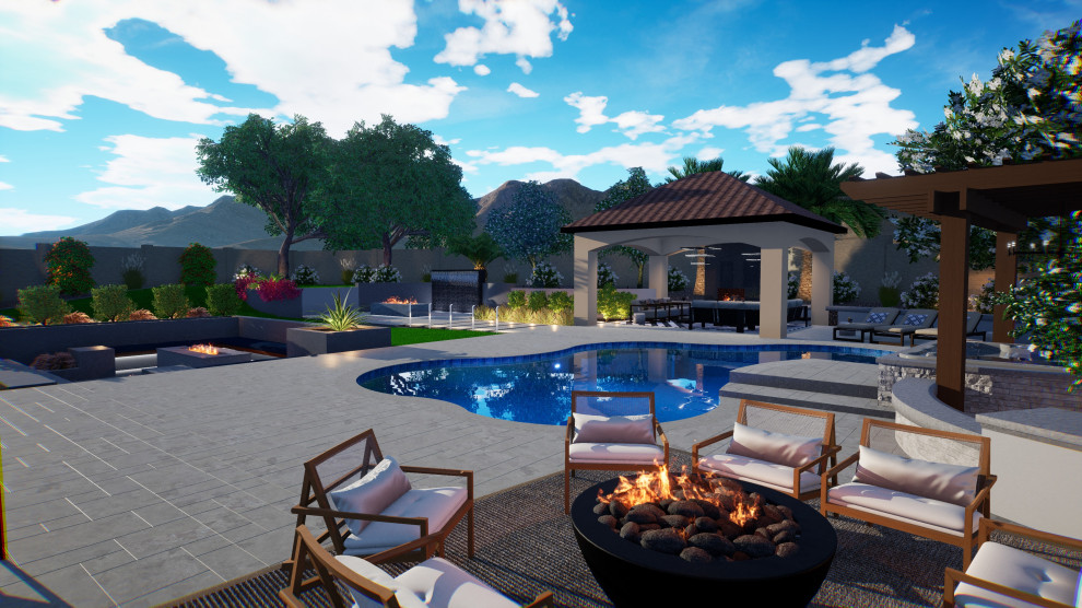 Example of a large backyard stone pool landscaping design in Phoenix