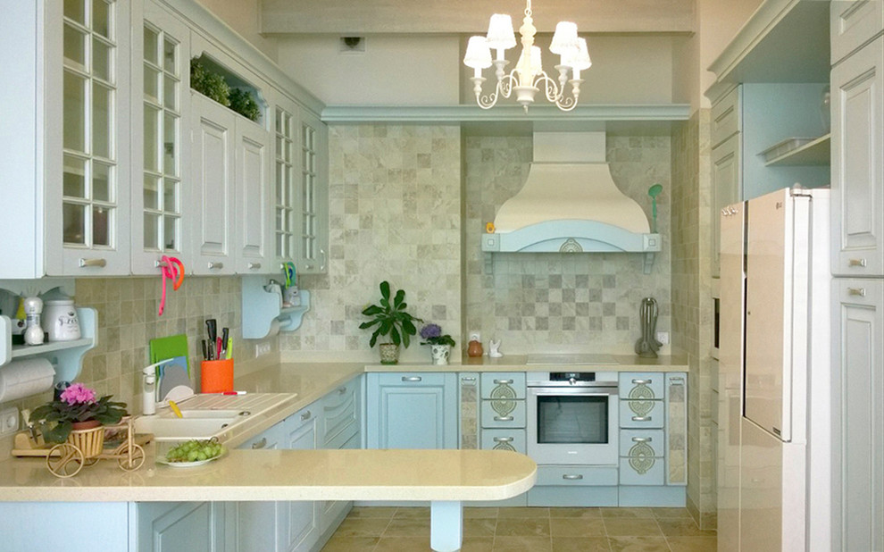 Inspiration for a mid-sized country u-shaped separate kitchen in Saint Petersburg with an undermount sink, raised-panel cabinets, turquoise cabinets, solid surface benchtops, beige splashback, ceramic splashback, white appliances, porcelain floors, no island, beige floor and beige benchtop.