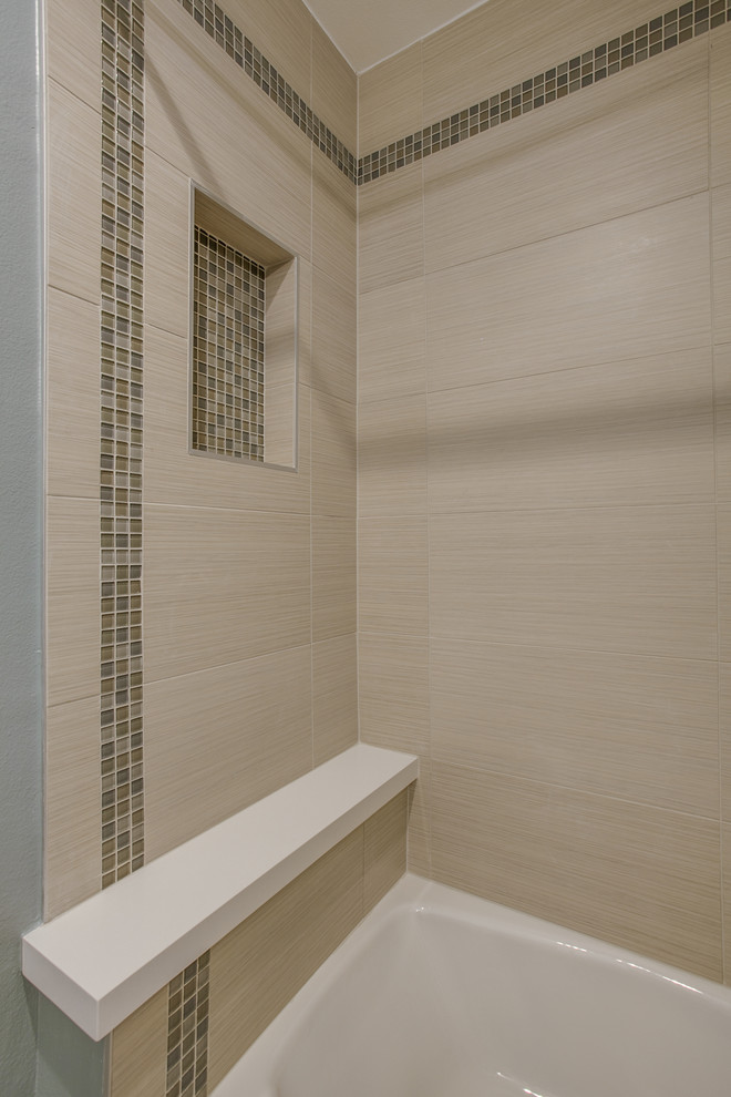 Inspiration for a mid-sized contemporary bathroom in Dallas with shaker cabinets, white cabinets, a shower/bathtub combo, beige tile, ceramic tile, green walls, ceramic floors and an undermount sink.