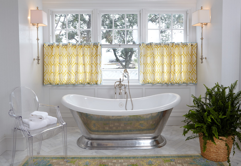 Design ideas for a traditional master bathroom in New York with a freestanding tub and white walls.