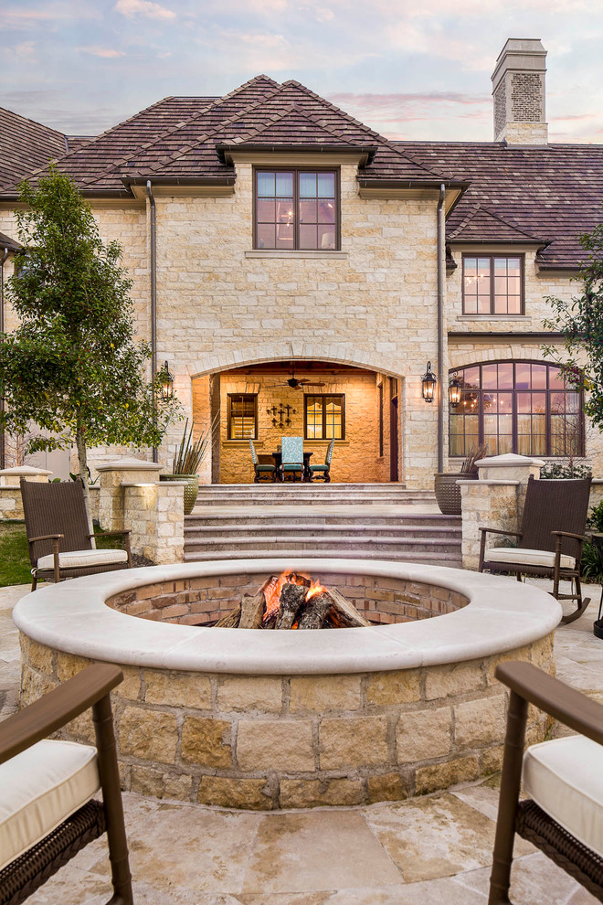 Inspiration for a traditional patio in Dallas with a fire feature and no cover.